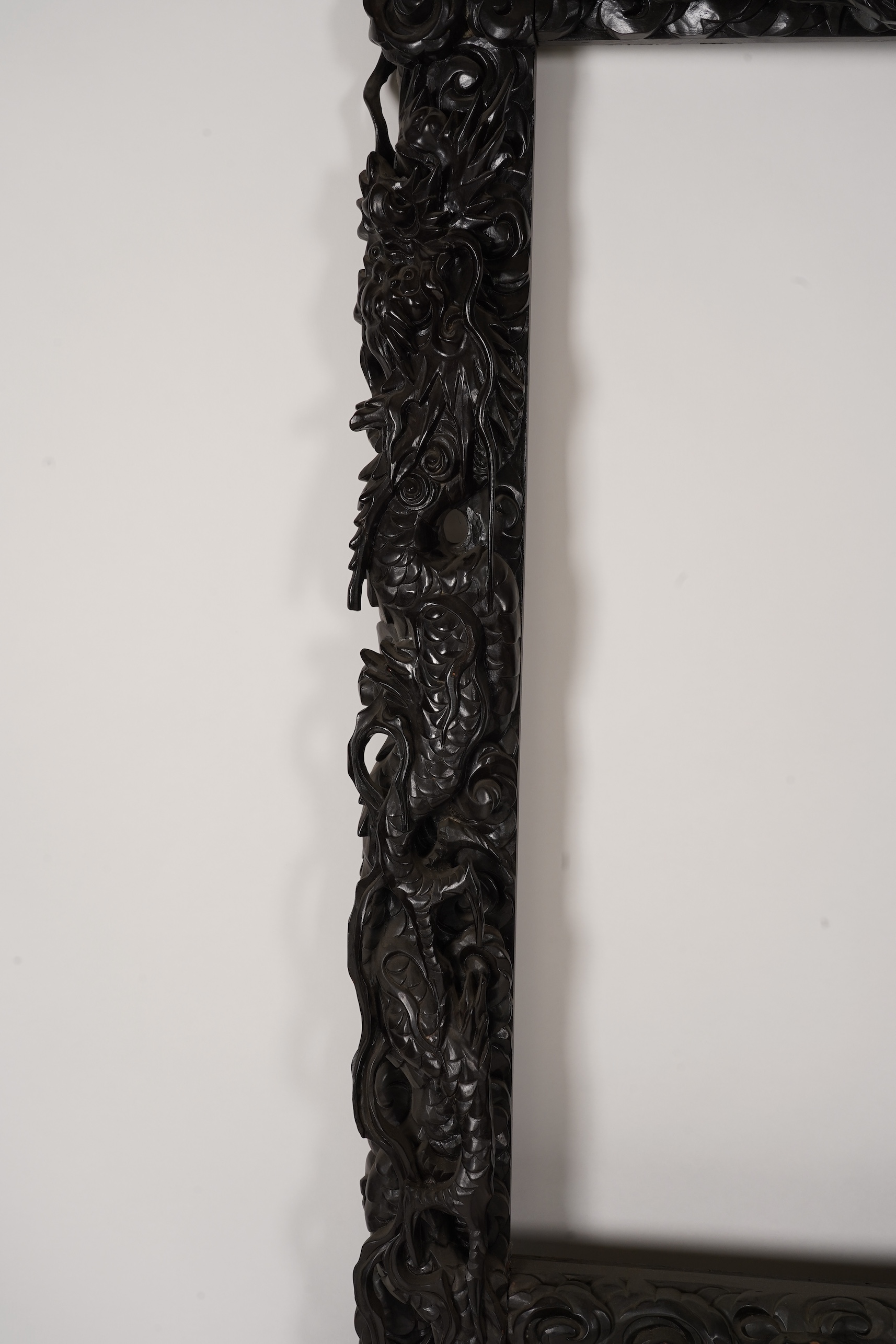 A pair of large Japanese carved hardwood ’dragon’ screen frames, Meiji period
